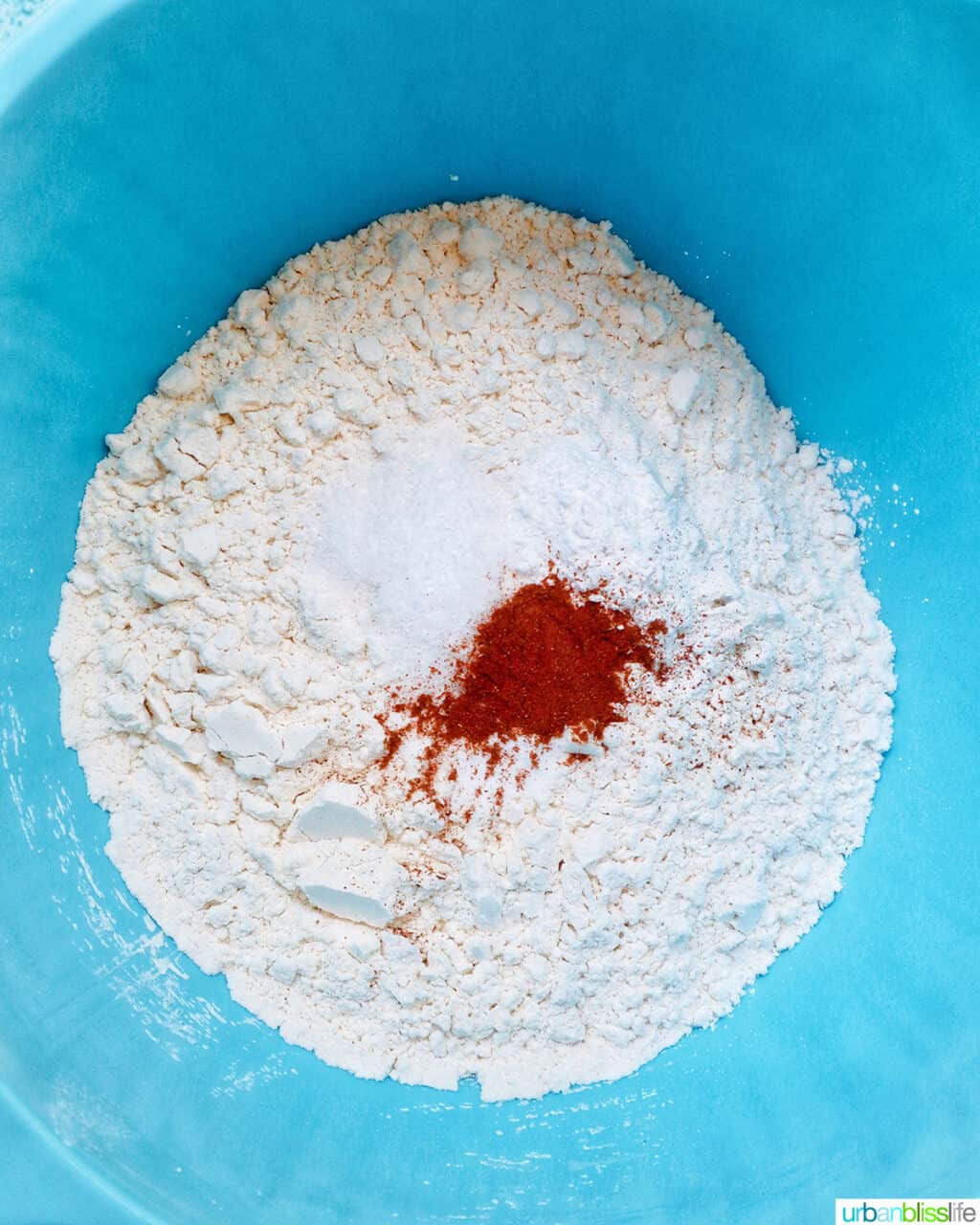 dry ingredients in a blue bowl.