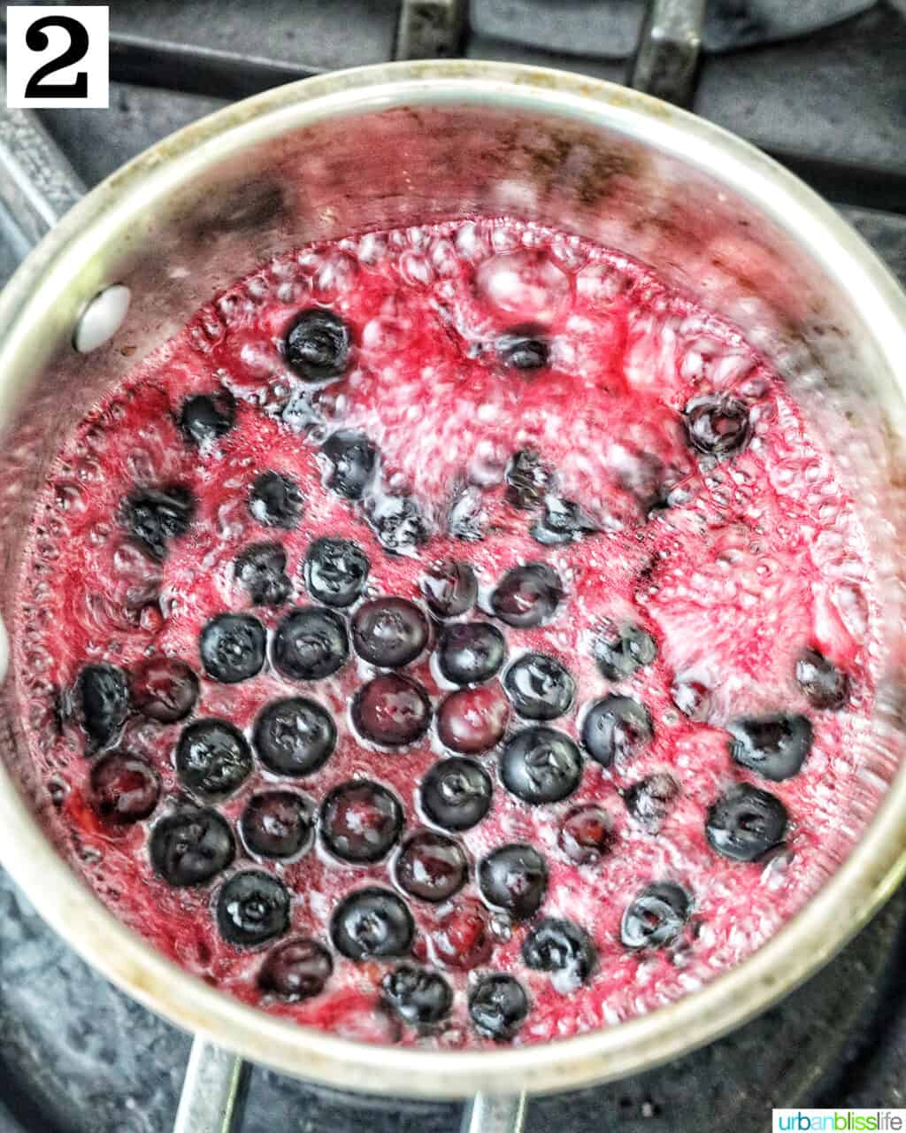 blueberries in a saucepan making blueberry compote.