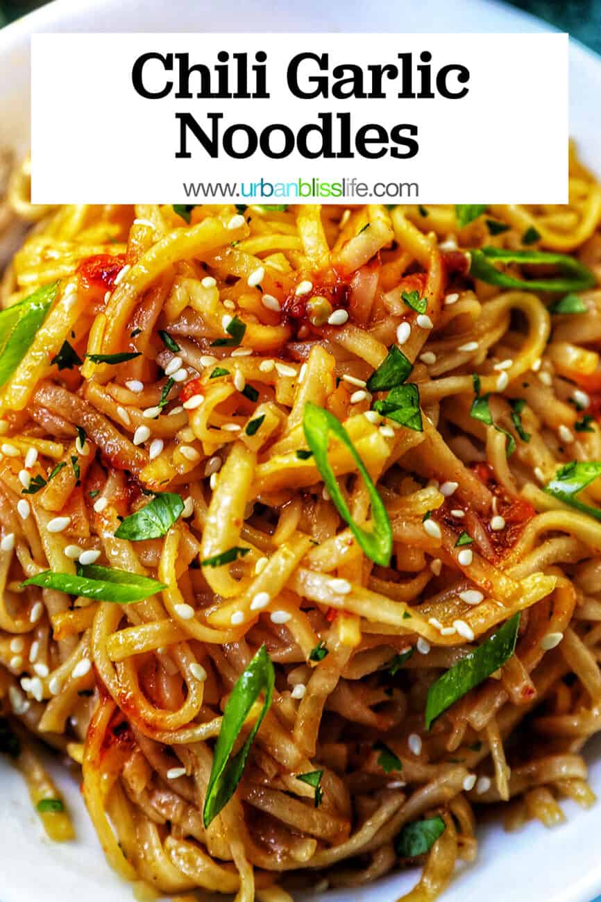 Chili Garlic Noodles with green onions and sesame seeds in a white bowl with title text.
