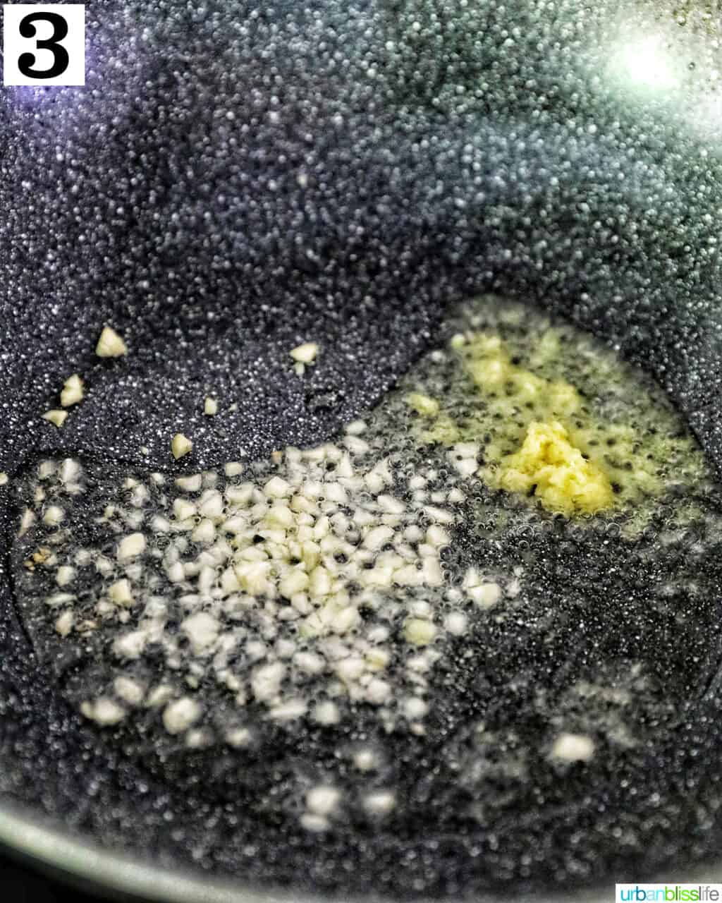 minced garlic and ginger in oil in a wok.