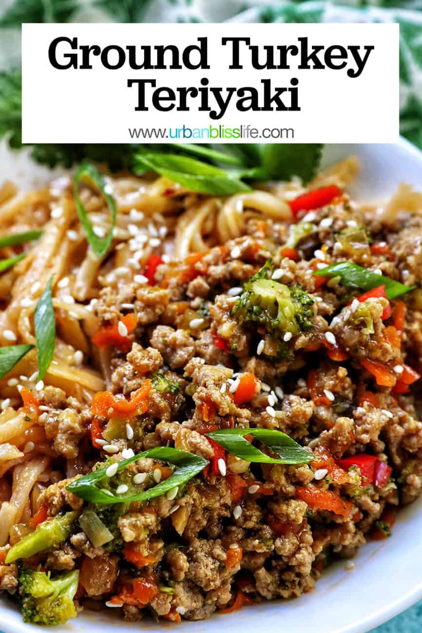 Ground Turkey Teriyaki with green onions, broccoli, carrots, and red bell peppers, in a white bowl with cilantro garnish with title text.