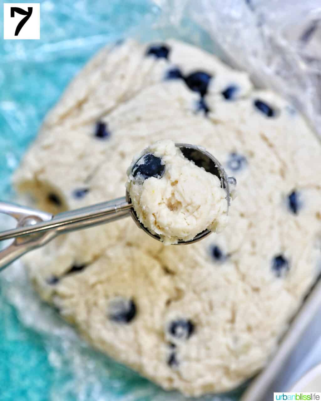 scoop of lemon blueberry cookie batter above the rest of the cookie batter.