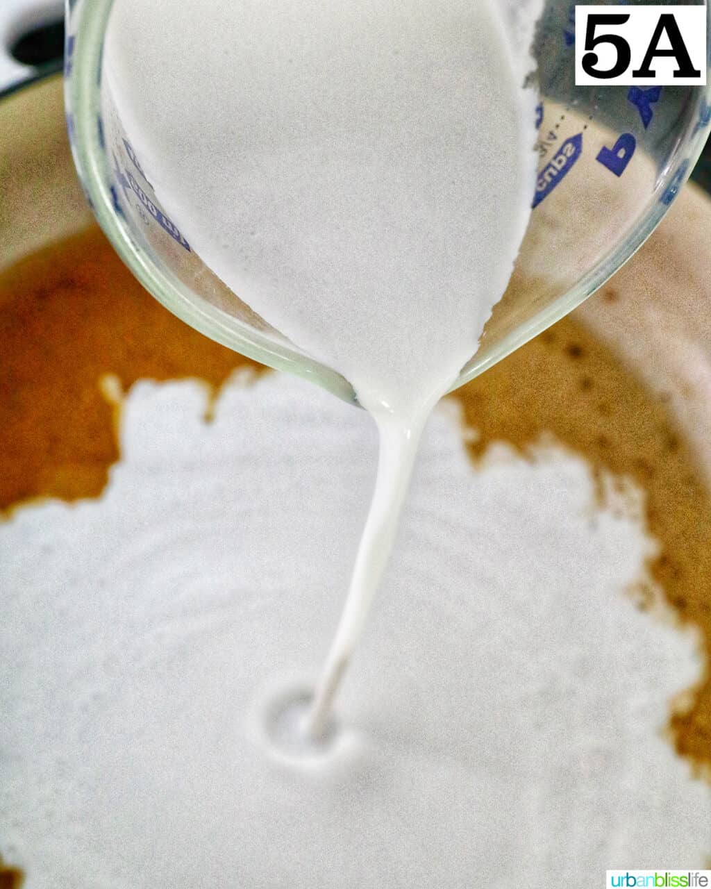 pouring cream into a pan.