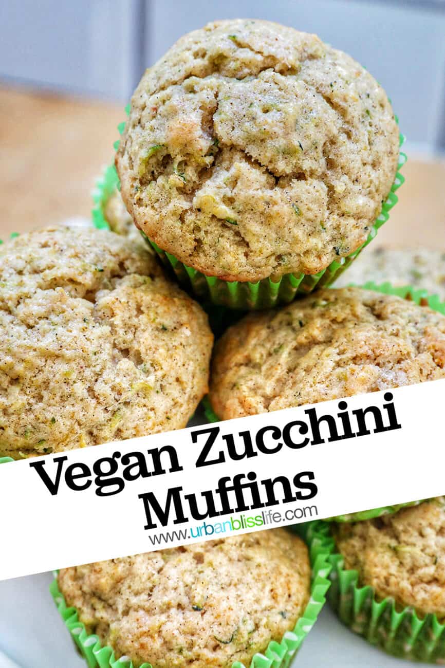 vegan zucchini muffins stacked on top of each other on a white plate with title text that reads "Vegan Zucchini Muffins."