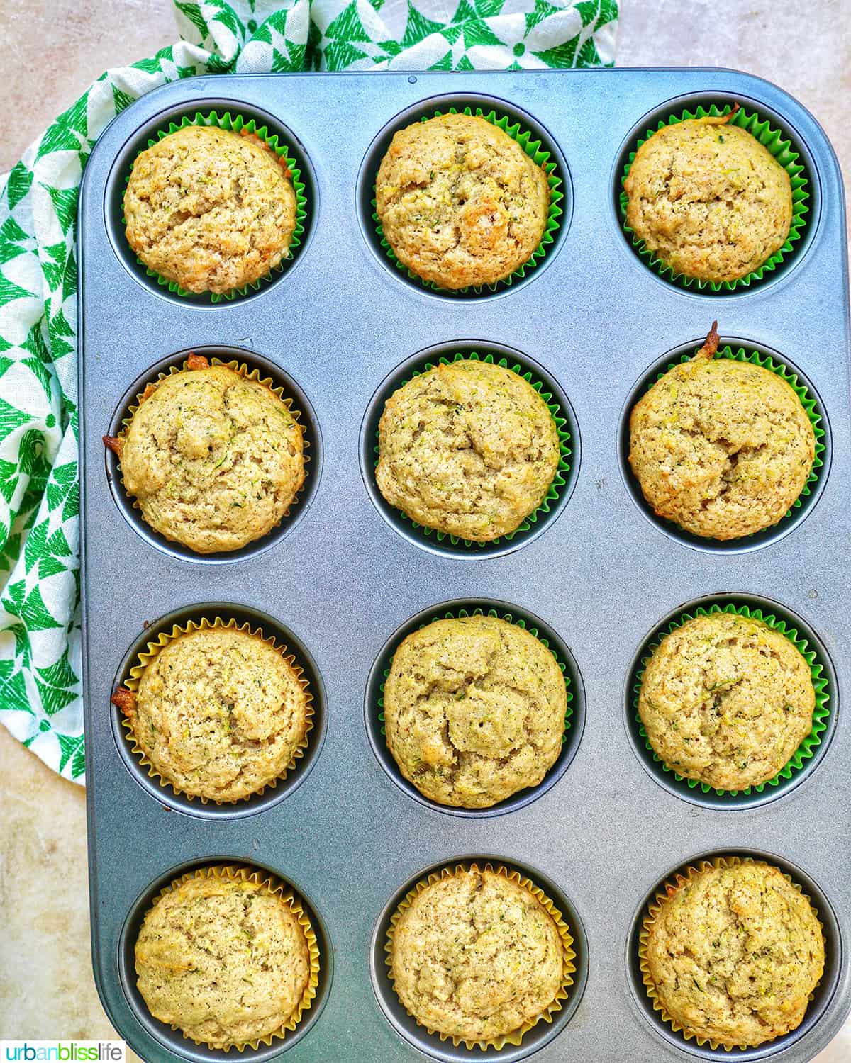 dairy-free zucchini muffins in a muffin tin / muffin pan.