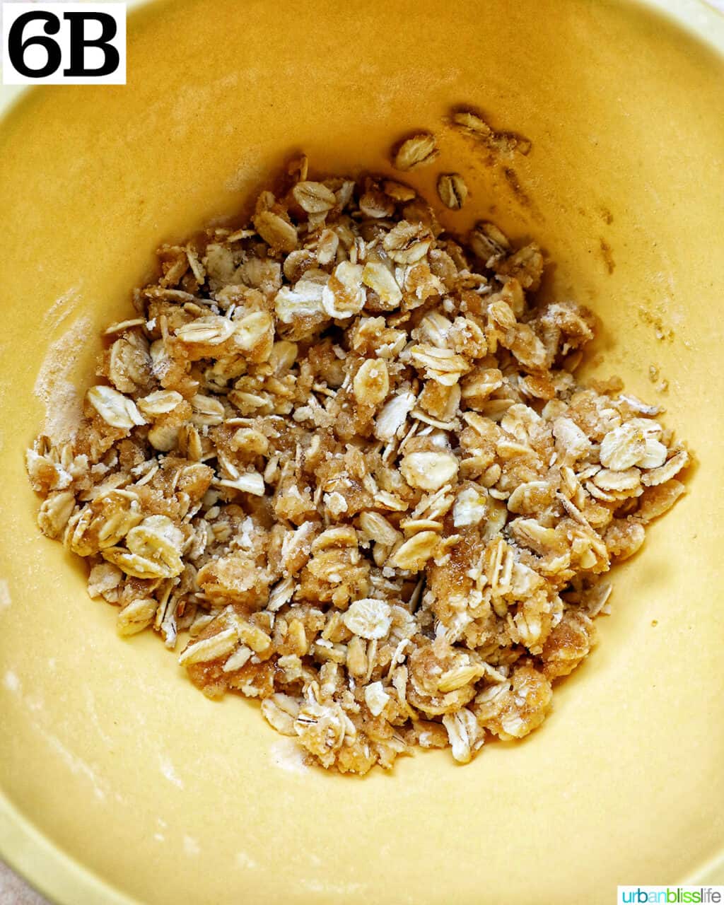 yellow bowl with oats, sugar, and flour to make a streusel topping.