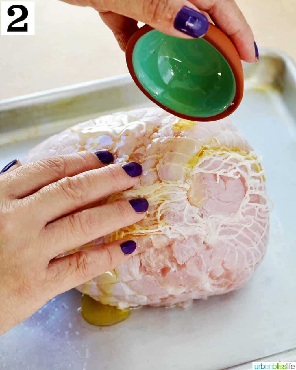 pouring olive oil over turkey breast.