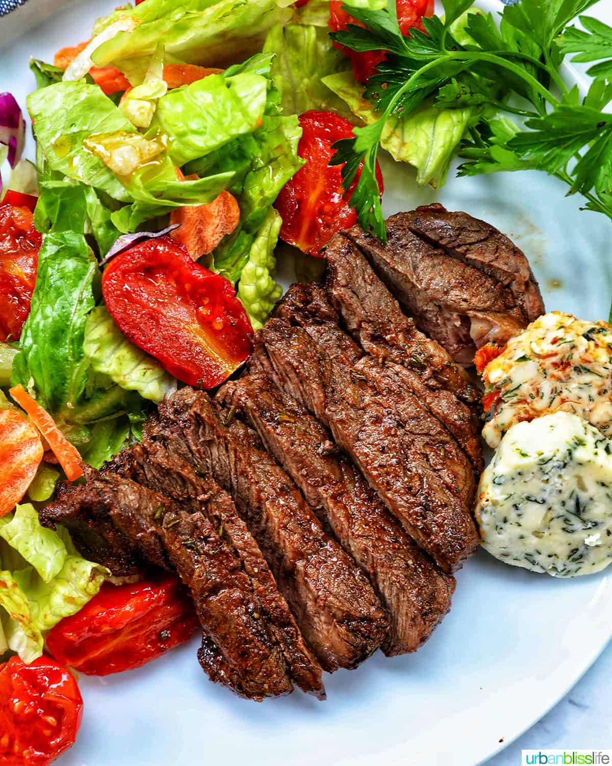 filet mignon sliced with salad.