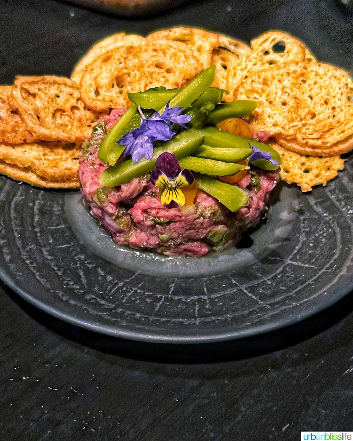beef tartare with crostini chips at Bar Oso restaurant in Whistler BC Canada.