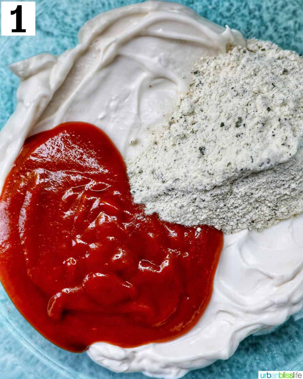 ingredients in a bowl to make buffalo ranch sauce.