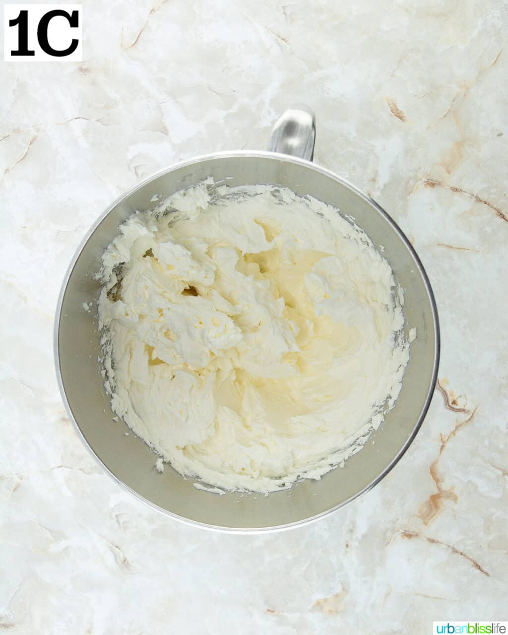 butter and sugar in a stainless steel stand mixing bowl.