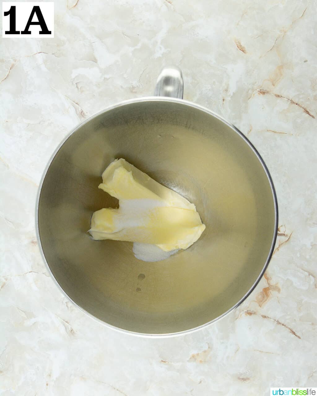 butter and sugar in a stainless steel stand mixing bowl.