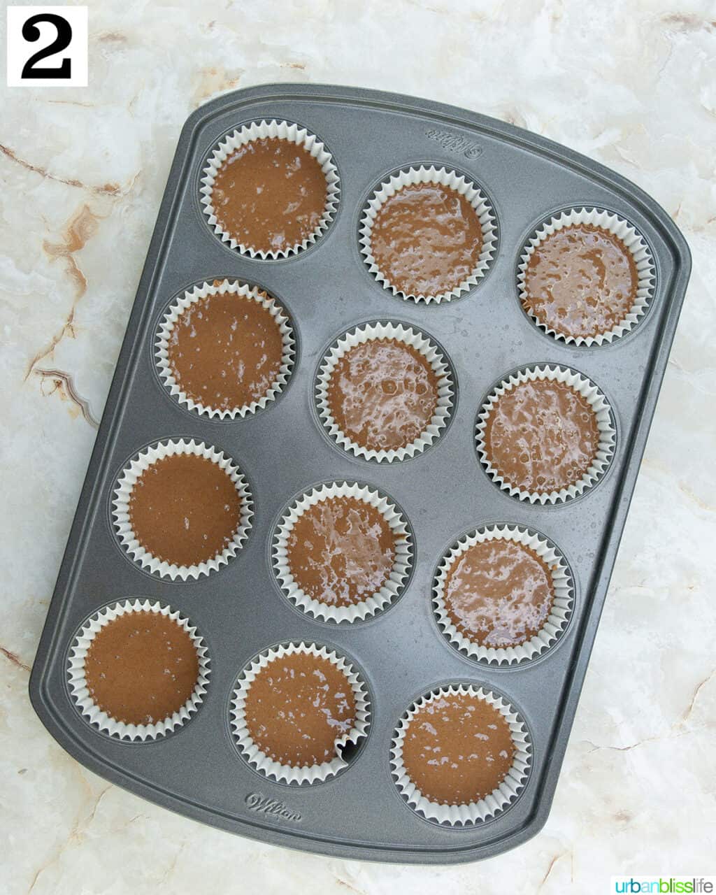 chocolate cake mix in a cupcake tin.