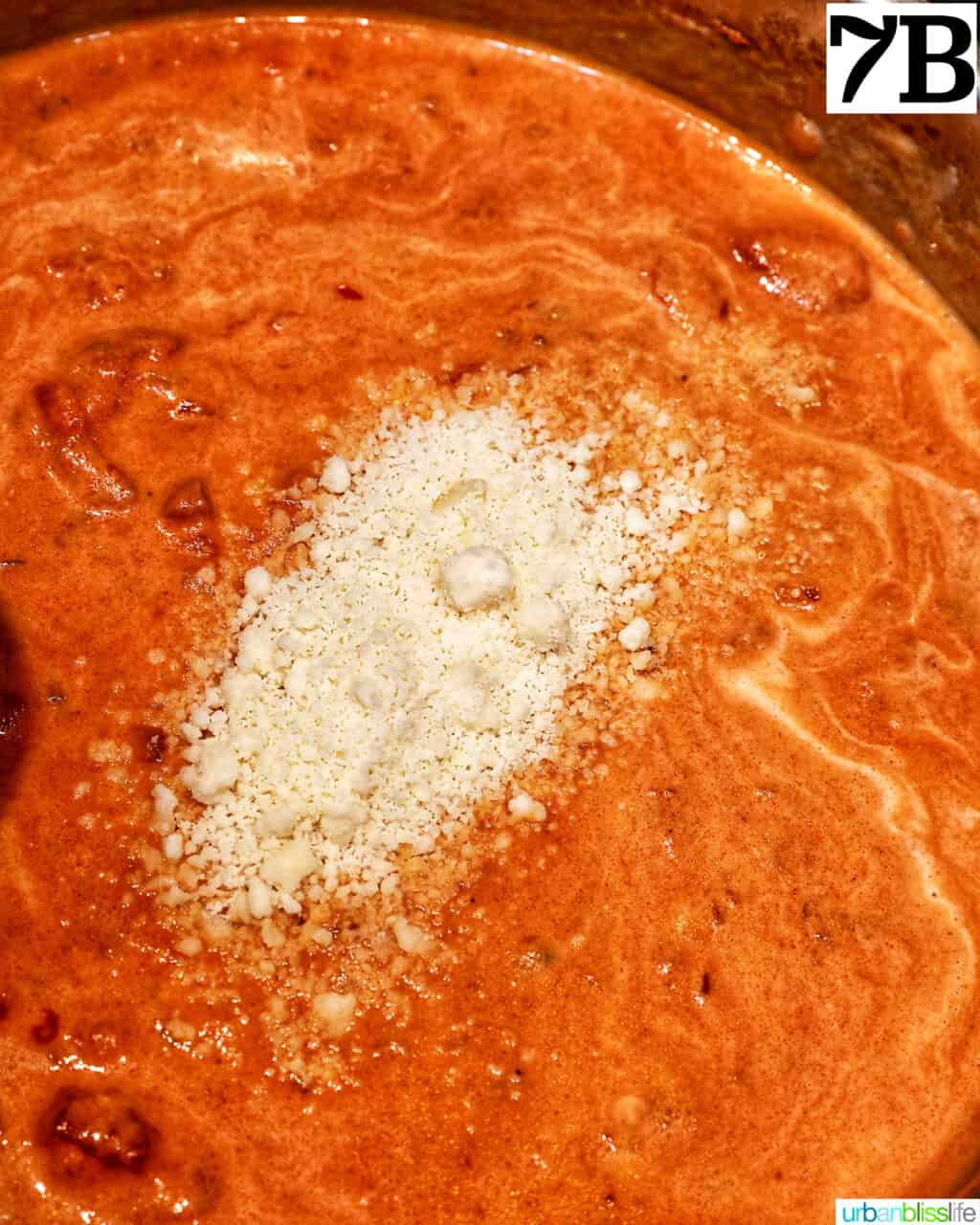 grated parmesan cheese added to tomato sauce.