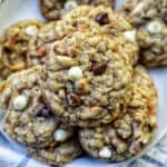 chocolate chip pretzel cookies stacked on a plate.