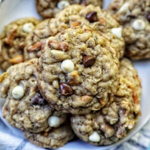 chocolate chip pretzel cookies stacked on a plate.