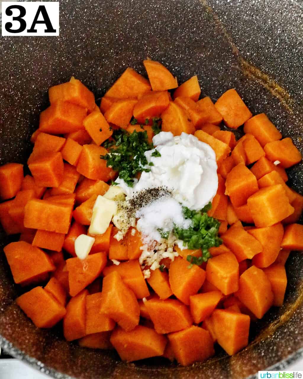 sour cream, butter, garlic, and herbs on top of chopped sweet potatoes in a large pot.