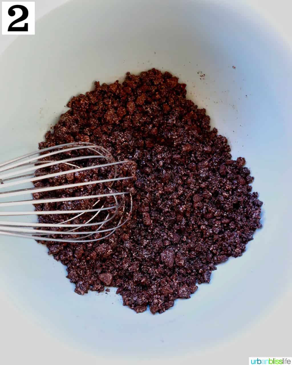 whisk in a bowl with crushed oreos.