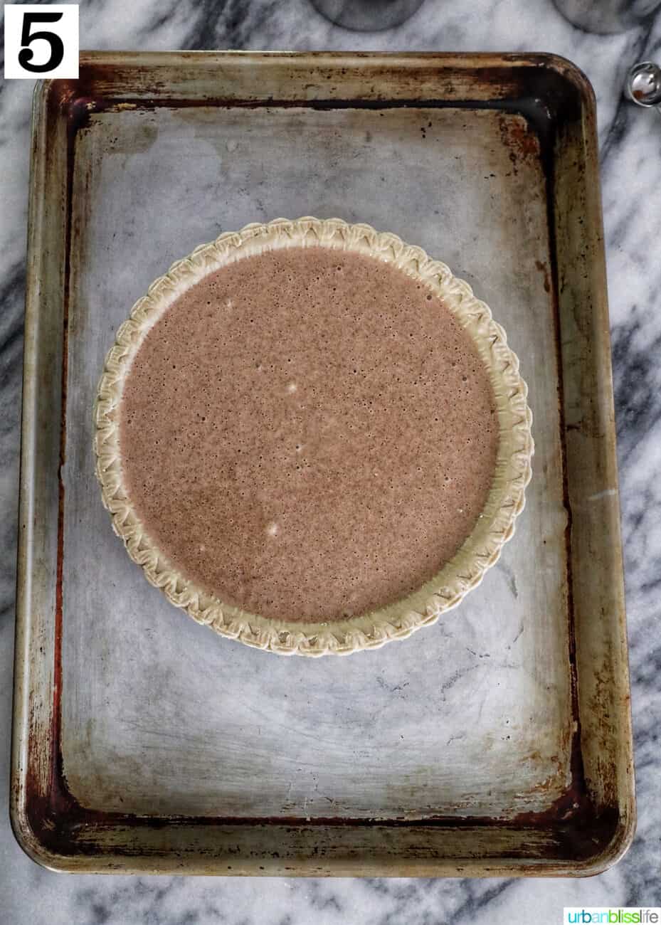 cinnamon pie on a baking sheet ready to bake.