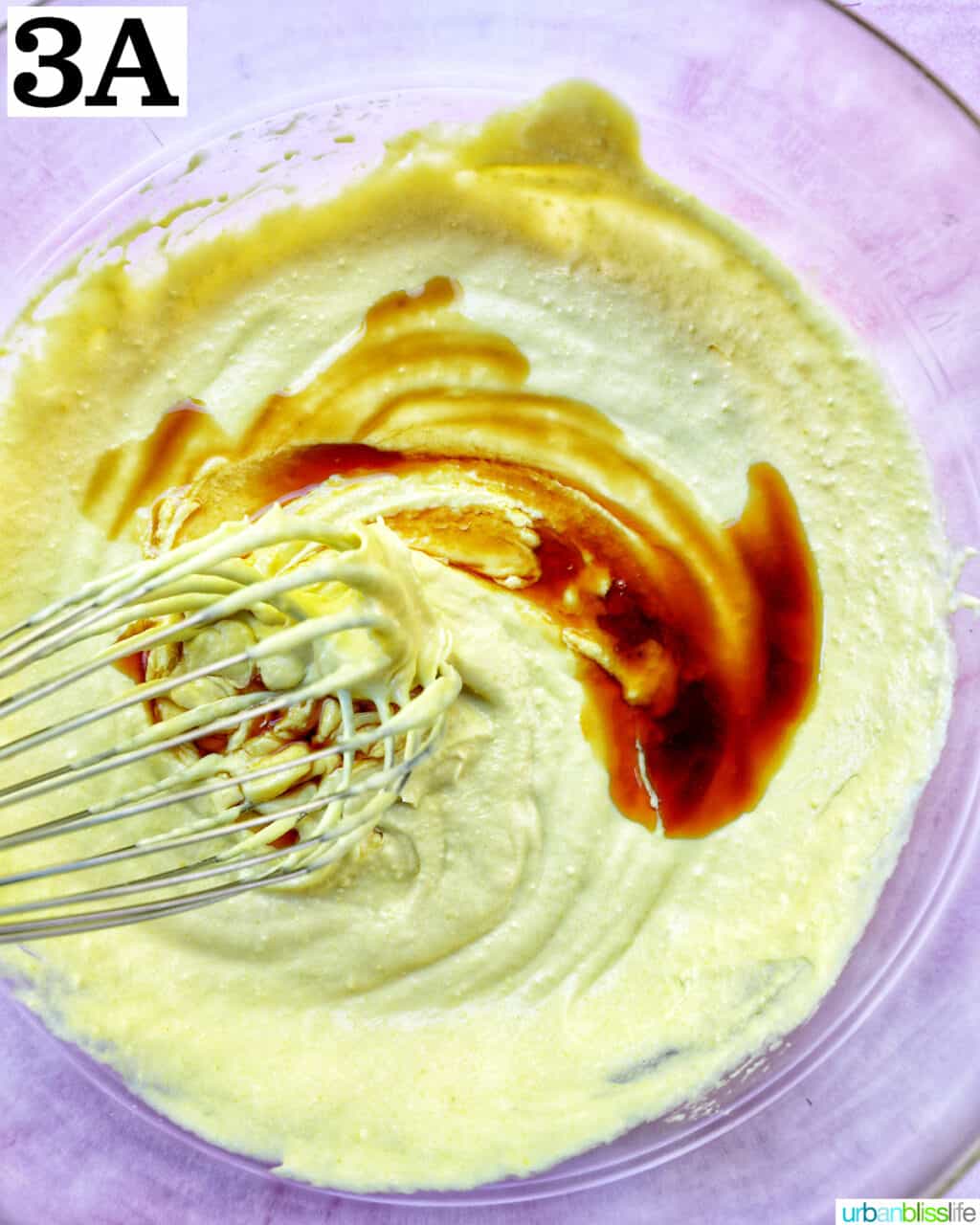 whisking vanilla into egg yolk mixture.