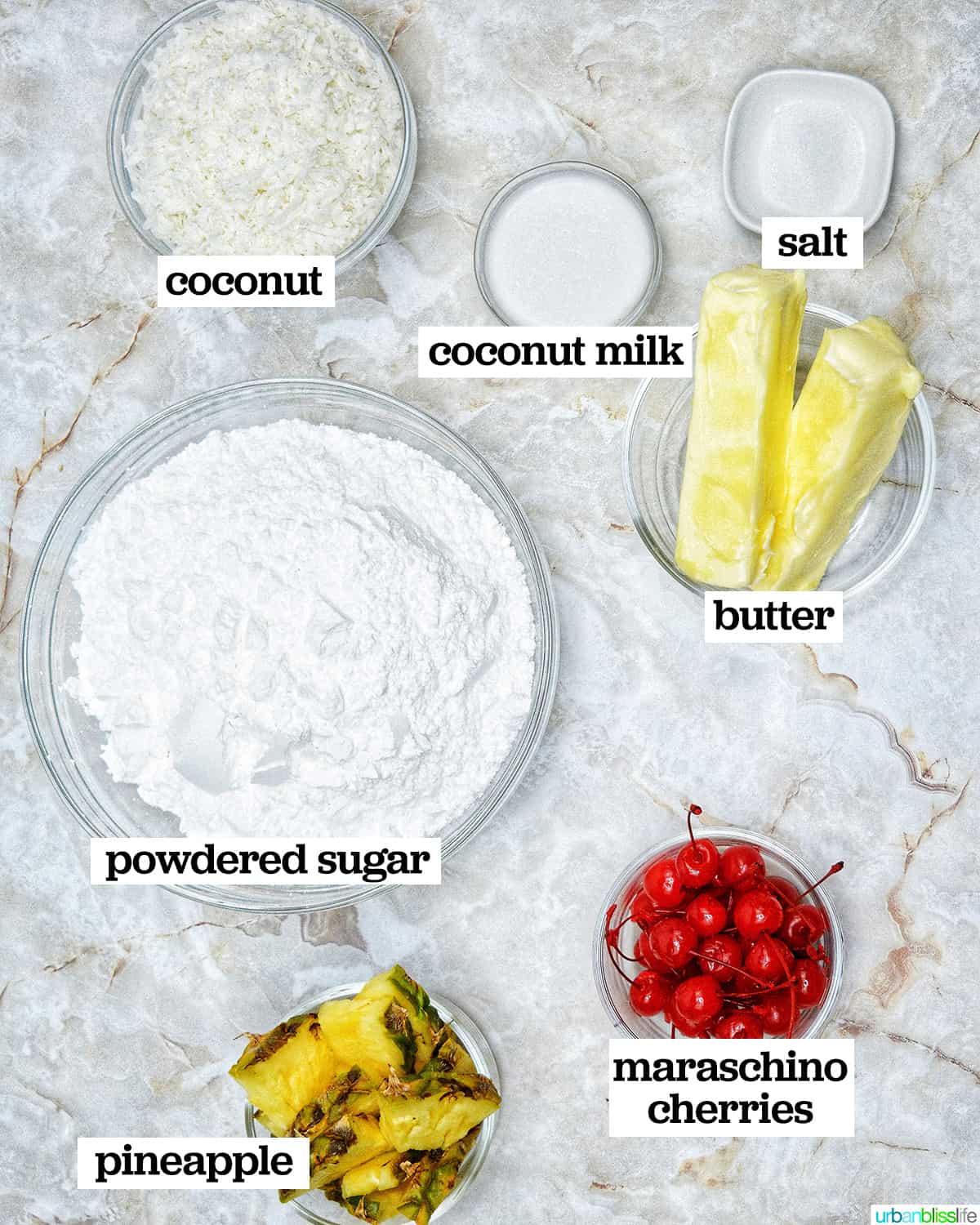 bowls of ingredients to make the frosting for pina colada cupcakes.