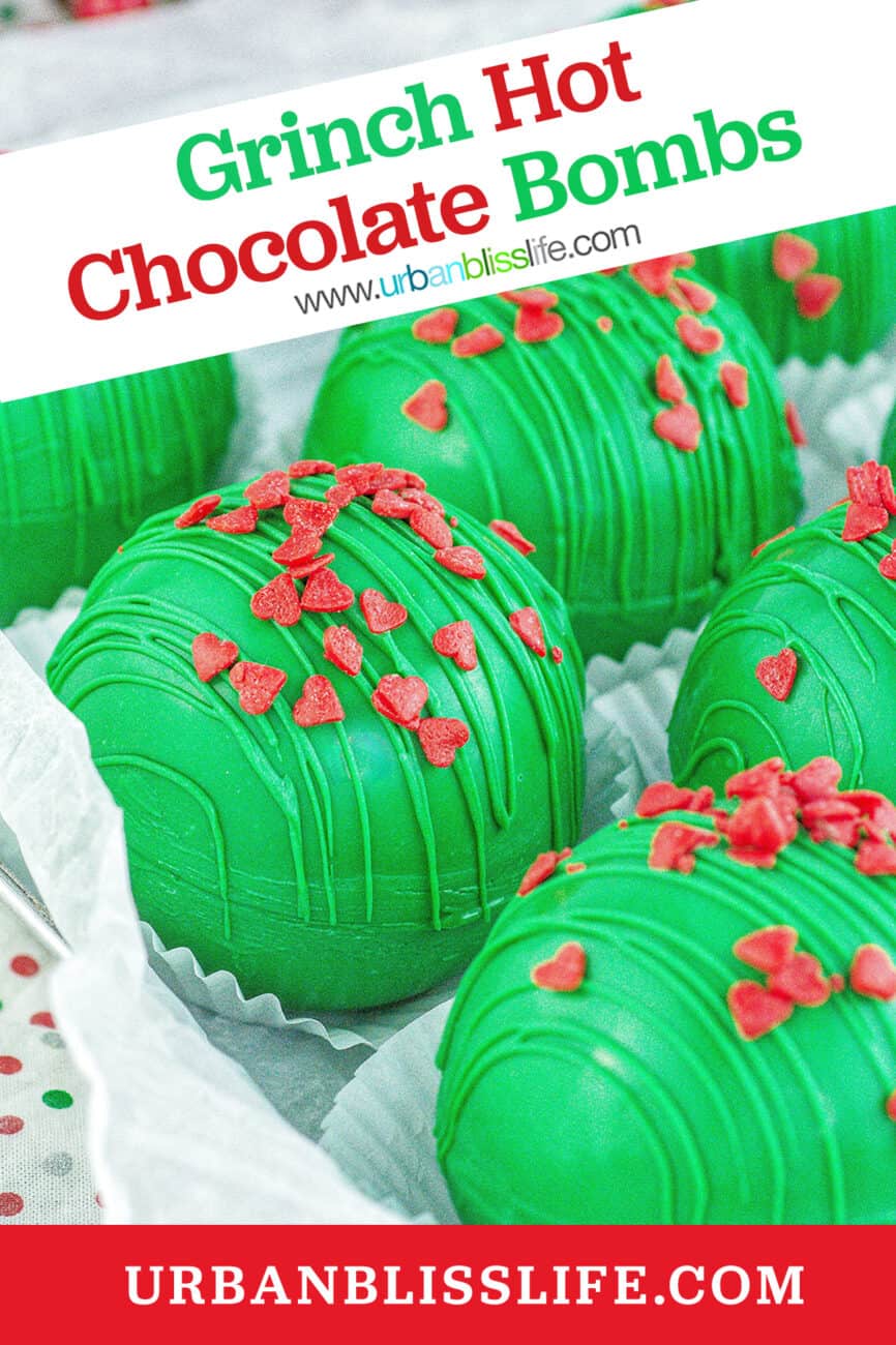 several bright green Grinch hot chocolate bombs with red heart sprinkles with title text.