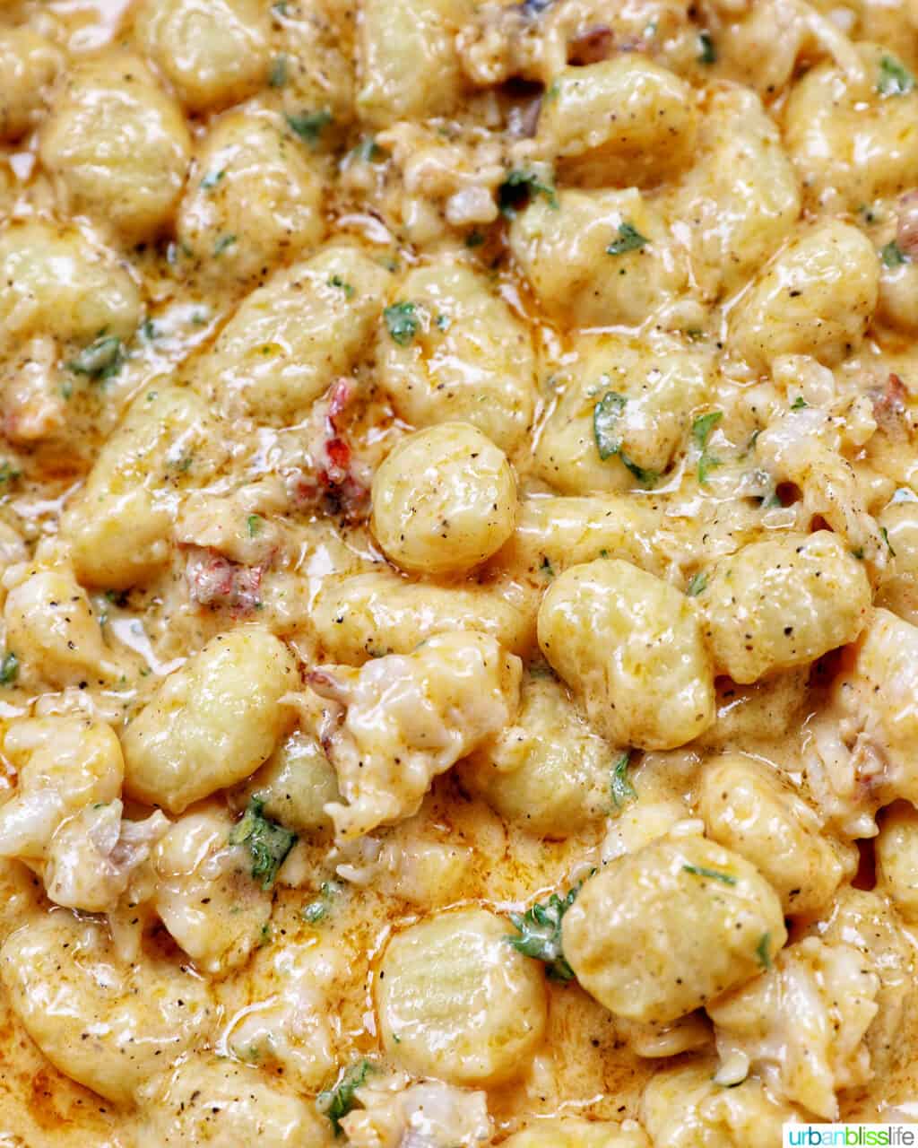 lobster gnocchi cooking in a saucepan.
