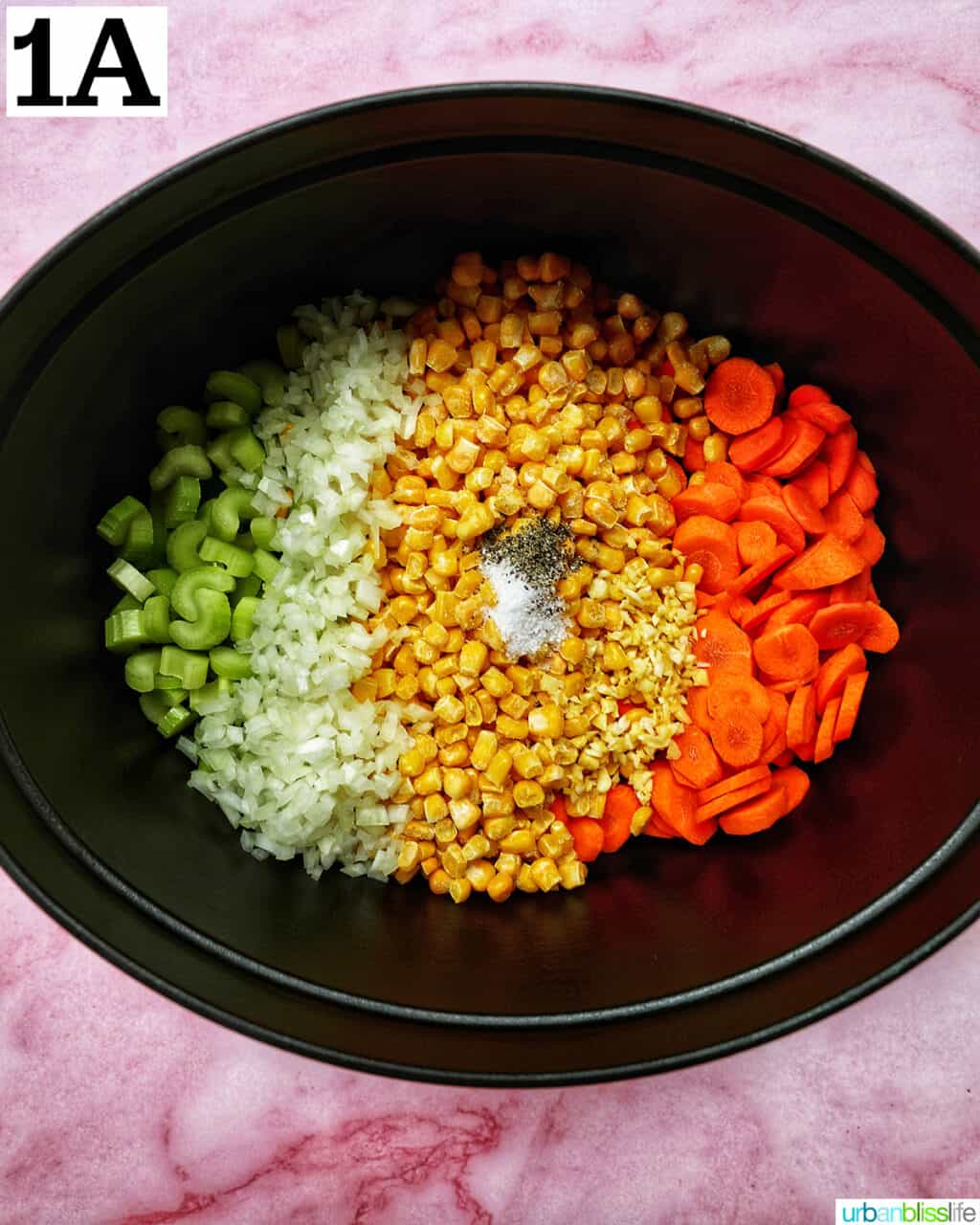 celery, carrots, corn, onions, and spices in a Dutch oven.