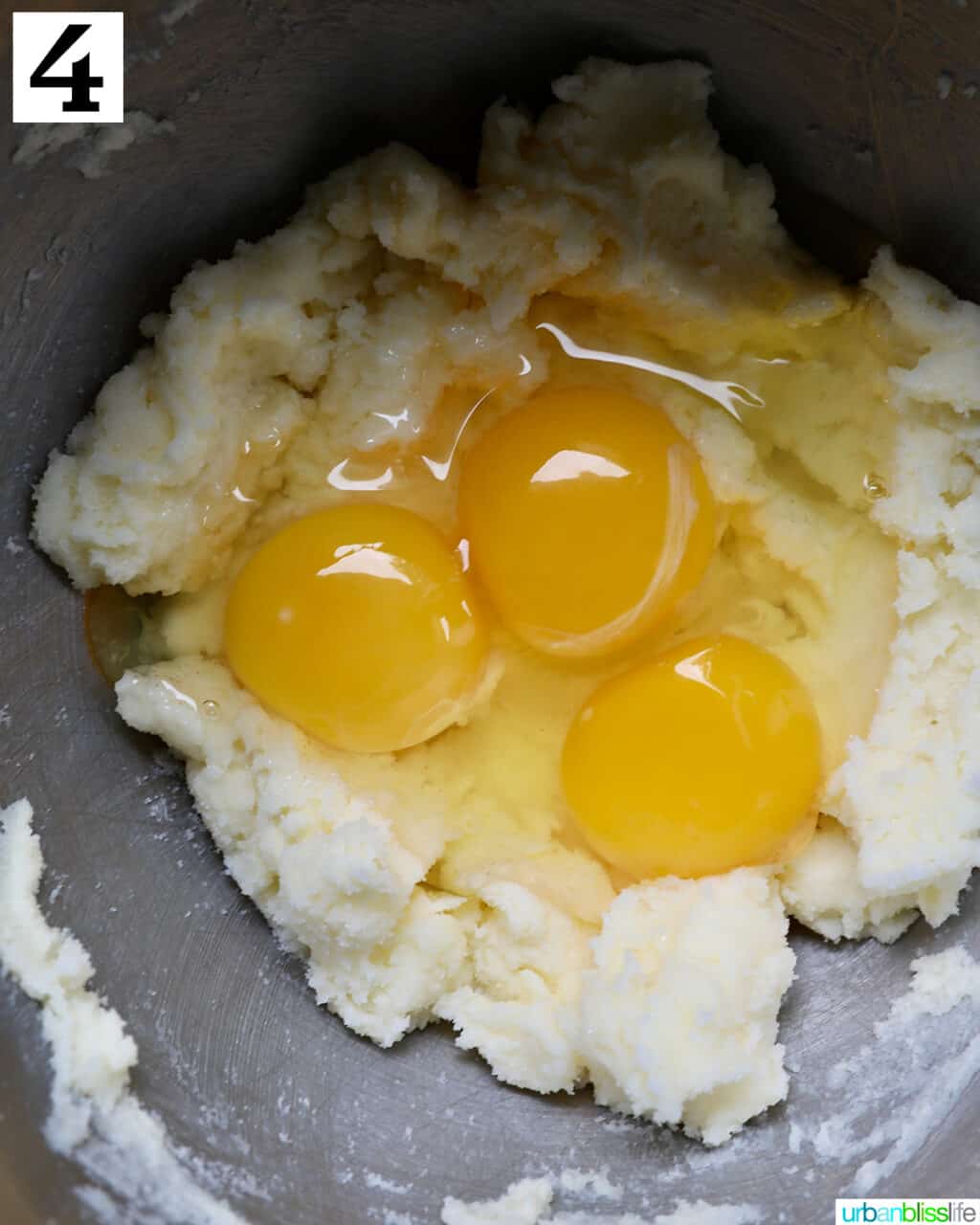 egg yolks and butter in a stainless steel bowl.