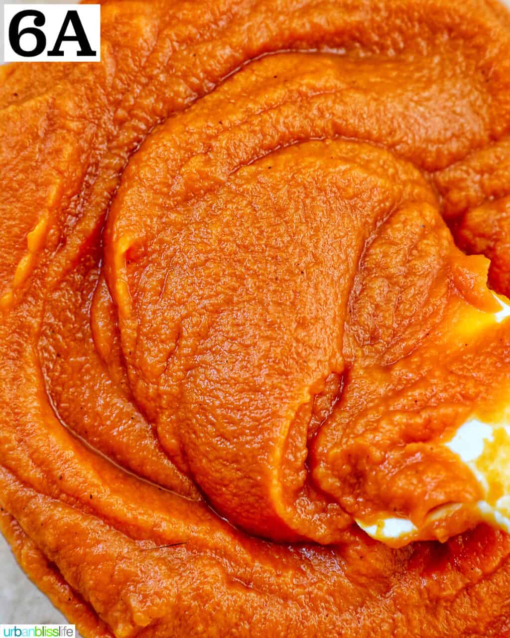 swirling sweet potato pie mix in a bowl.
