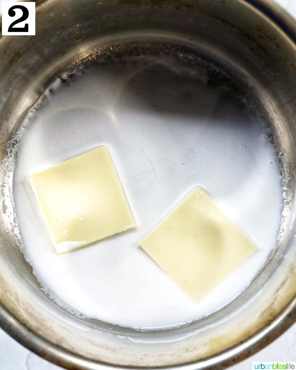 butter with cream in a saucepan.