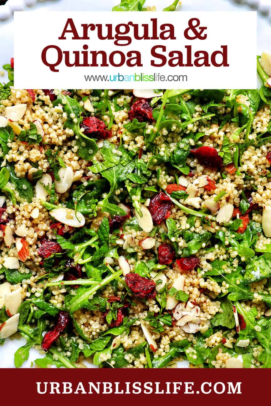 arugula and quinoa salad with sliced almonds and dried cranberries.