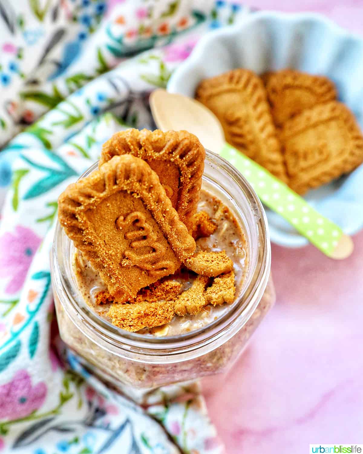 Biscoff overnight oats in a jar with crumbled Biscoff cookies on top.