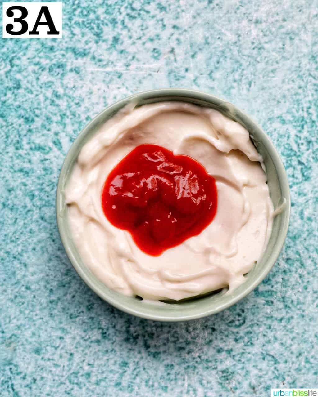 sriracha on top of mayonnaise.