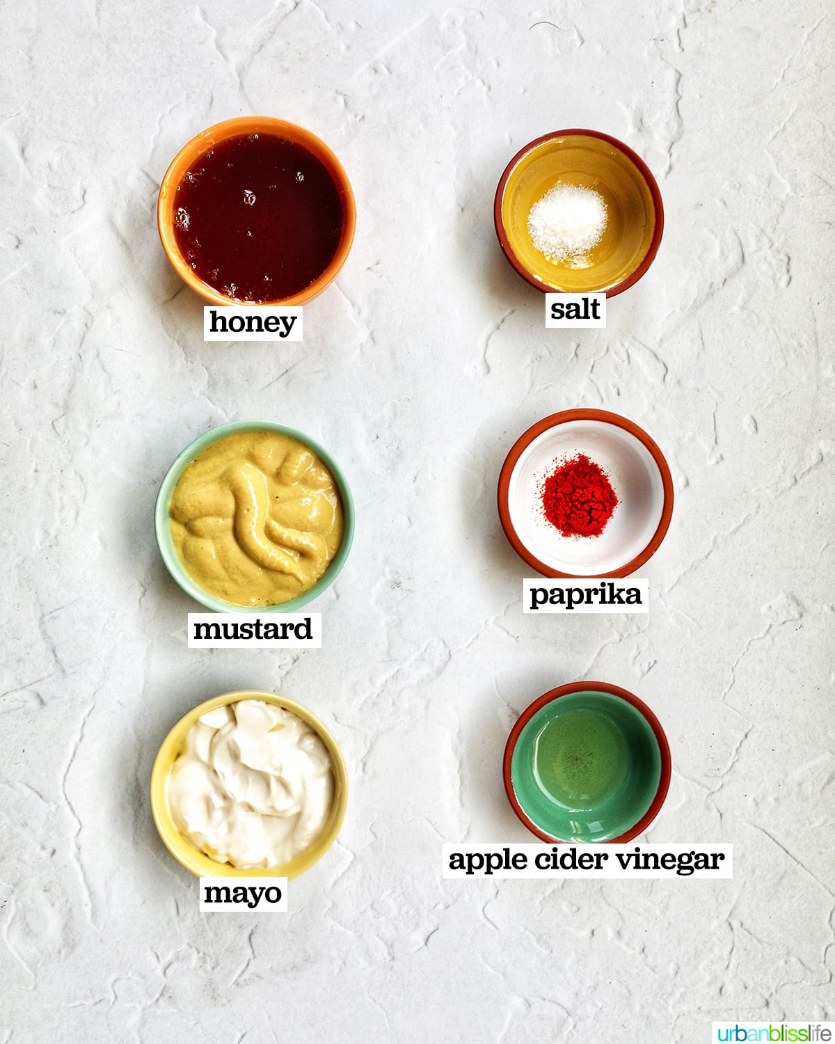 bowls of six ingredients to make honey mustard dipping sauce.