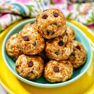 stack of Peanut Butter Chocolate Chip Oatmeal Balls on a green and yellow plate.