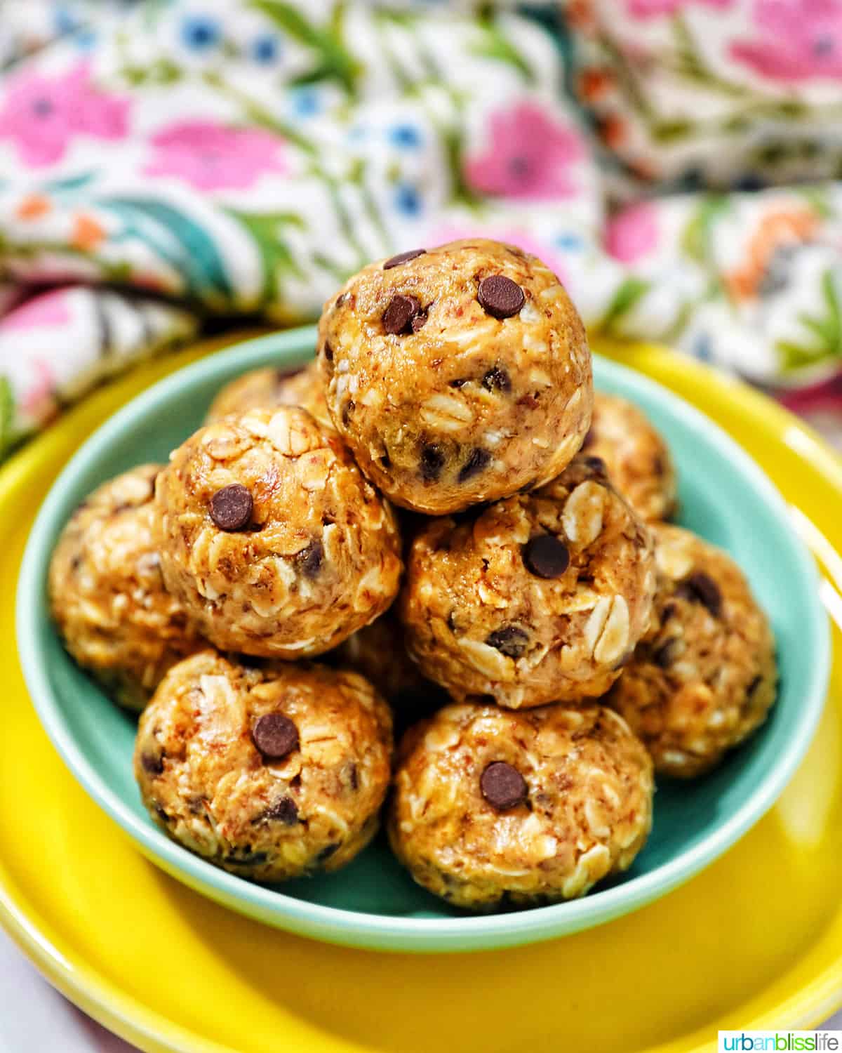 stack of Peanut Butter Chocolate Chip Oatmeal Balls on a green and yellow plate.