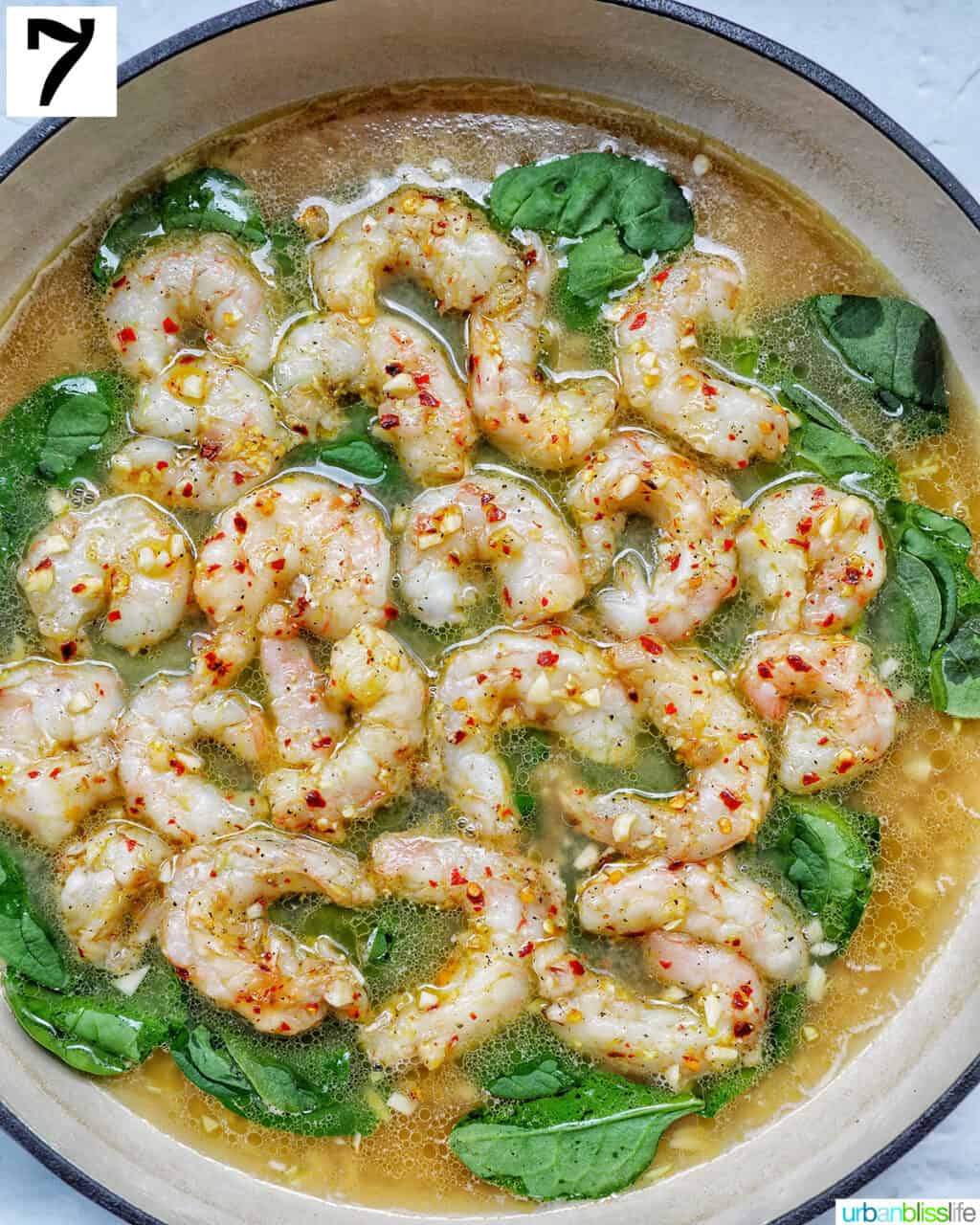 shrimp in a large skillet cooking.