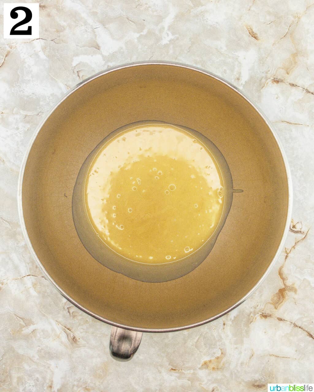 stand mixer bowl with batter.