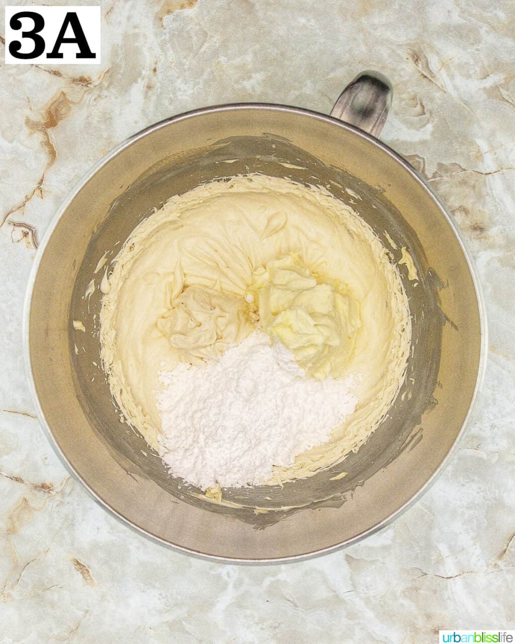 stand mixer bowl with batter.