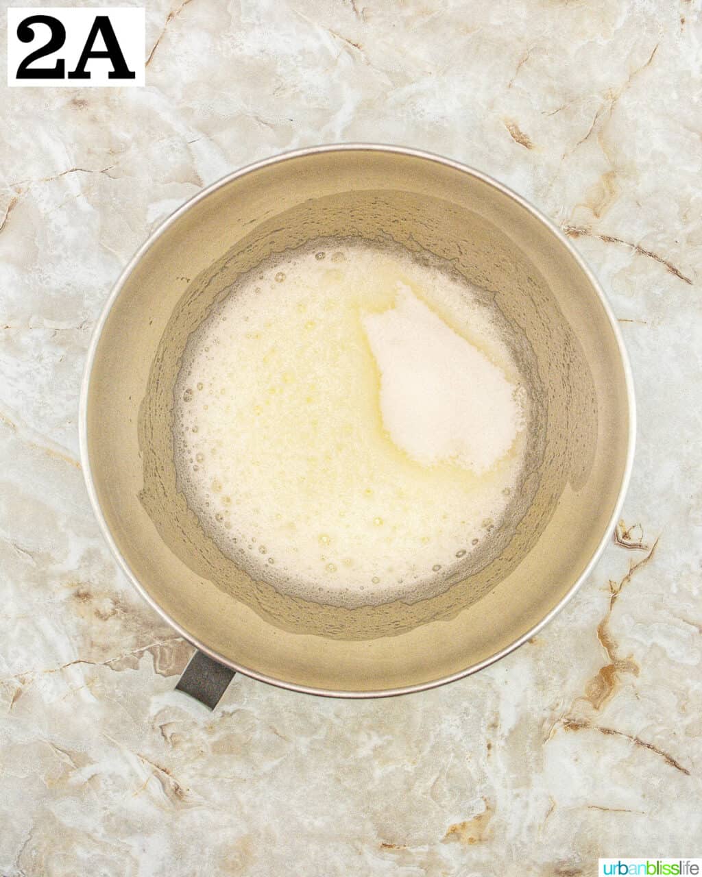 stand mixer bowl with batter.
