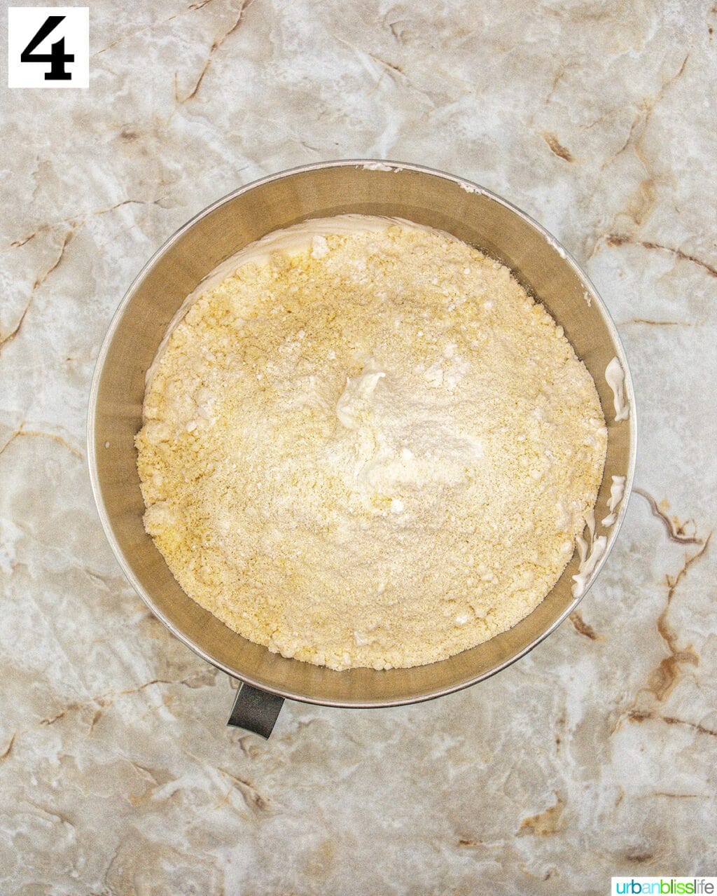 stand mixer bowl with batter.