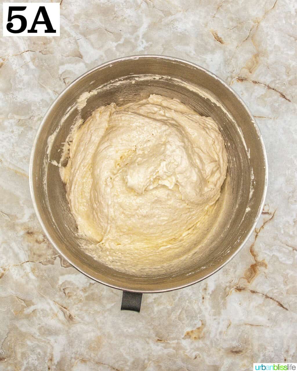 stand mixer bowl with batter.