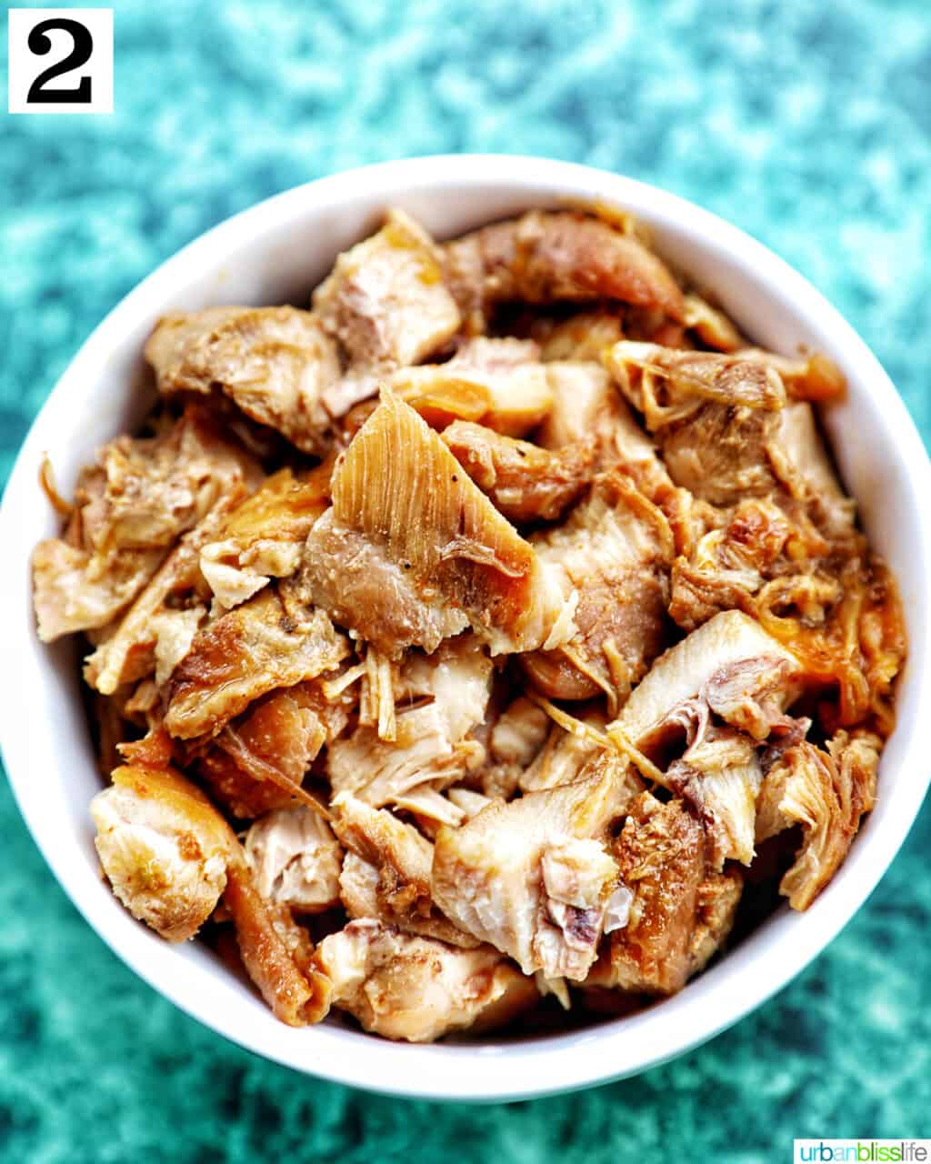 bowl of shredded chicken adobo.