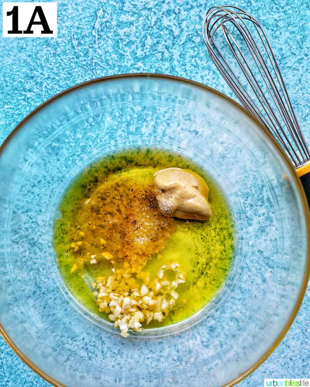 lemon mustard vinaigrette dressing in a large glass bowl.