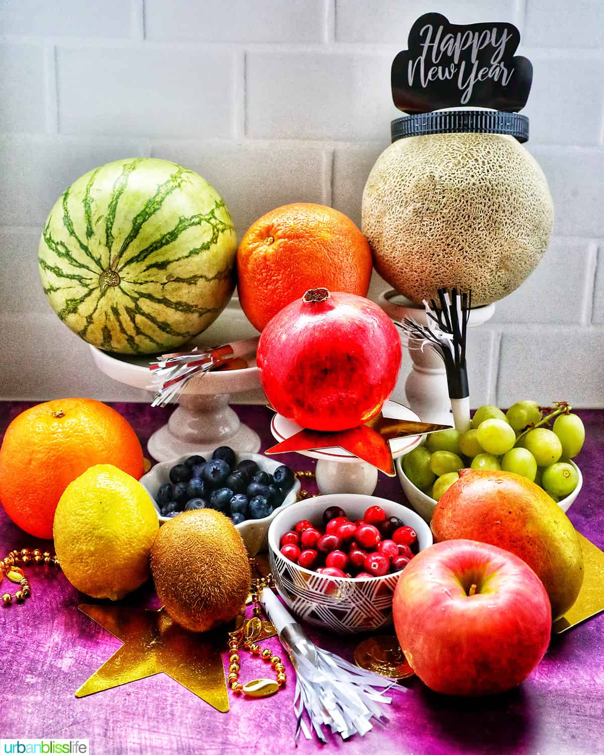 several colorful, round fruits on display.