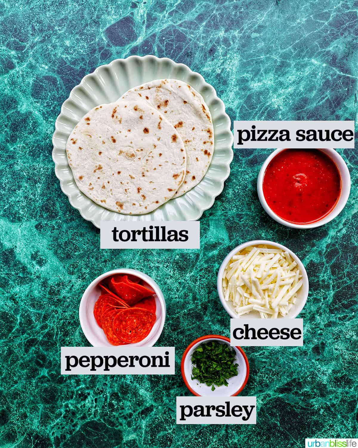 bowls of ingredients to make air fryer mini pizzas.