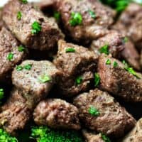 air fryer steak bites with chopped parsley garnish.