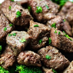 air fryer steak bites with chopped parsley garnish.