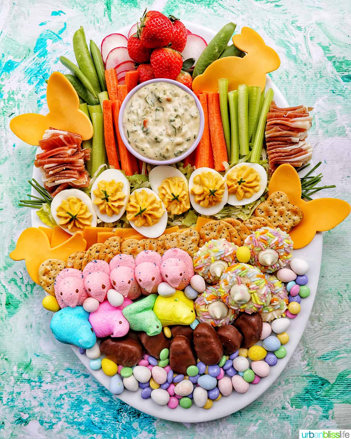 Easter Charcuterie Board with savory and sweet snacks.
